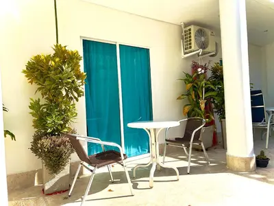 a table and chairs in front of a building at Charme 64 Hotel Boutique in Cartagena de Indias
