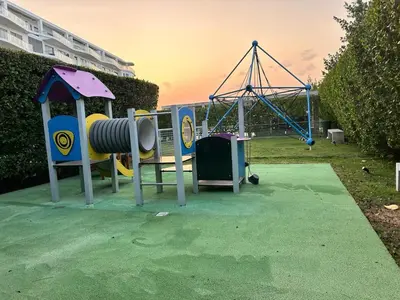 a playground with a slide and a swing at LUXURY APARTAMENT, MORROS ECO VISTA AL MAR. in Cartagena de Indias