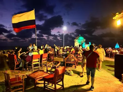 a large crowd of people sitting in chairs with a flag at LUXURY APARTAMENT, MORROS ECO VISTA AL MAR. in Cartagena de Indias