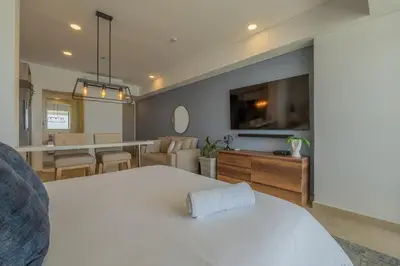 a room with a living room and a dining room at Condominio exclusivo nuevo frente al mar Cartagena Beach in Cartagena de Indias