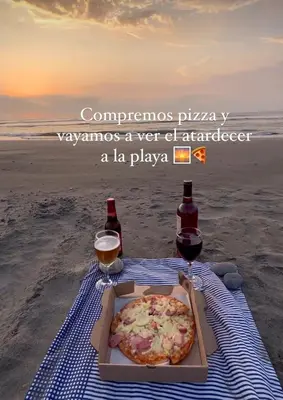 a pizza in a box on the beach with two drinks at Dreimar Hotel Boutique in Cartagena de Indias