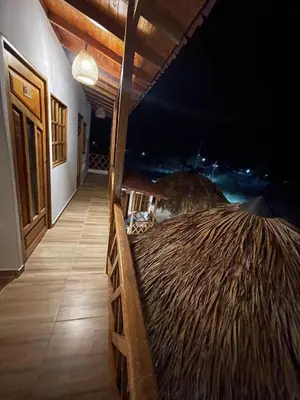 a porch of a resort with a view of the ocean at Cabaña El Cangrejo Azul - Blue Crab House in San Onofre