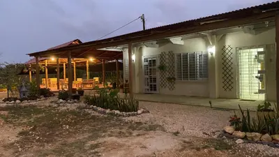 a house with a porch with lights on it at Cabañas Paulamar - Apto 4 - Tolú in Santiago