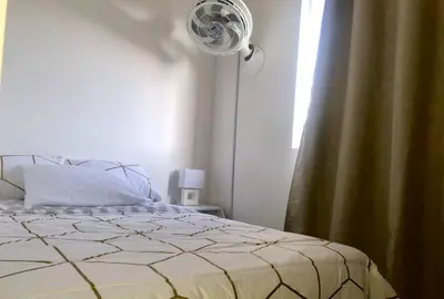 a bedroom with a bed and a window at Acogedor apartamento en Cartagena/asequible in Cartagena de Indias