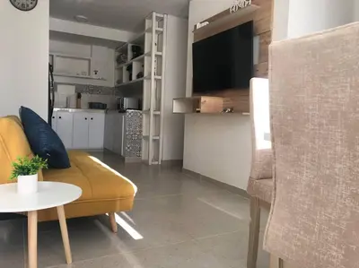 a living room with a couch and a table at Acogedor apartamento en Cartagena/asequible in Cartagena de Indias