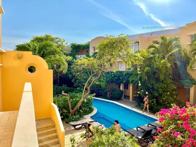an image of a swimming pool at a resort at by Calamari Homes - Parque Centenario casa 206 walled city in Cartagena de Indias