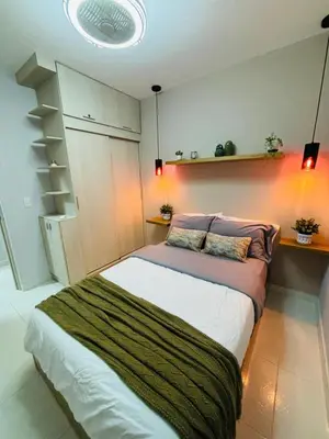 a bedroom with a large bed with lights on it at Nice Apartment close to Historic City and beach in Cartagena de Indias