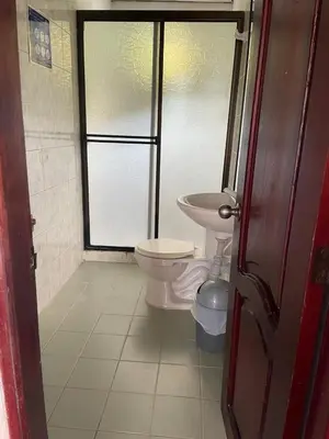 a bathroom with a toilet and a sink at Apartamentos Poseidon in Coveñas