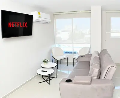 a living room with a couch and chairs at Excelente ubicación y cómodo apto, perfecto para ti! in Barranquilla