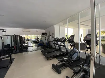 a gym with a bunch of treadmills and ellipticals at Apartamento playa Morros, La boquilla, Cartagena de indias in Cartagena de Indias