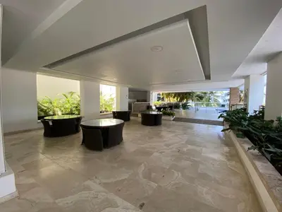 a living room with a table and some plants at Apartamento playa Morros, La boquilla, Cartagena de indias in Cartagena de Indias