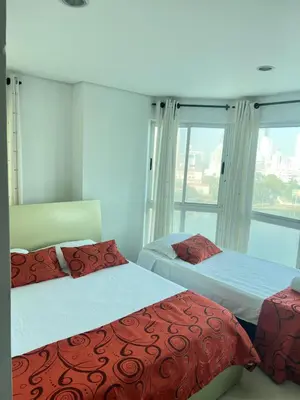 a bedroom with two beds and a window at Torres del lago de 3 habitaciones in Cartagena de Indias