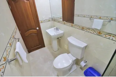 a bathroom with a toilet and a sink at Torres del lago de 3 habitaciones in Cartagena de Indias