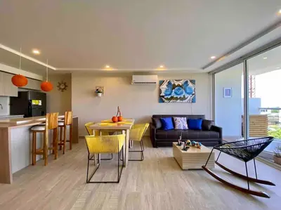 a living room with a couch and a table at Dominique in Cartagena de Indias