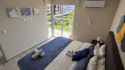 a bedroom with a bed with two crosses on it at Dominique in Cartagena de Indias