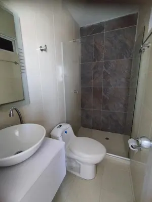 a bathroom with a toilet and a sink and a shower at HOTEL BELLAMAR in Cartagena de Indias