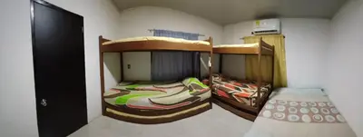 a room with two bunk beds in a room at Cabaña Moñitos cerca al mar e Isla Fuerte in Moñitos