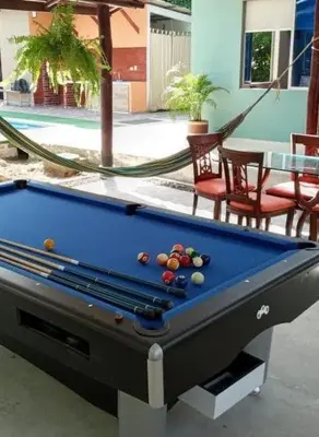a pool table sitting in a yard with a pool at Espectacular Cabaña en Santa Veronica in Santa Veronica