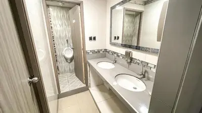 a bathroom with two sinks and a shower at Hotel & Restaurante Oasis CTG in Cartagena de Indias