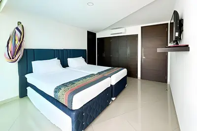 a bedroom with a bed and a television in it at Apartamento 2 Dormitorios Morros. Vista Mar in Cartagena de Indias