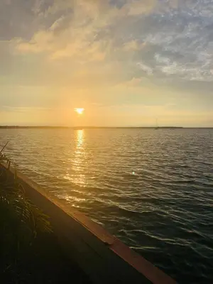 a sunset over a large body of water at Apartamento de descanso Om Shanti Om in Coveñas