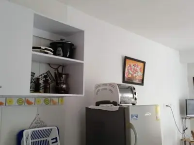 a kitchen with a refrigerator and a toaster on top of it at Cartagena más cómoda y económica in Cartagena de Indias
