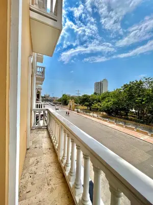 a balcony of a building with a view of a street at by Calamari Homes - Parque Centenario 206 walled city in Cartagena de Indias