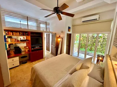 a bedroom with a bed and a ceiling fan at by Calamari Homes - Parque Centenario 206 walled city in Cartagena de Indias