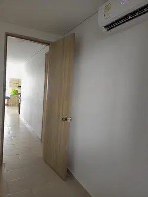 an open door in a room with a white wall at Apartamentos Mi Reserva OK - Fontaine Bleu in Coveñas