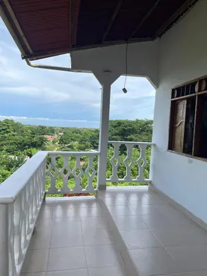 a balcony of a house with a view at Casa Majanicho in Rincón