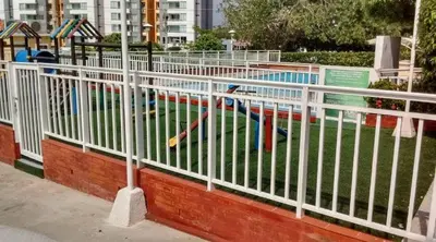 a white fence in front of a swimming pool at Habitación Estrella de Mar in Barranquilla