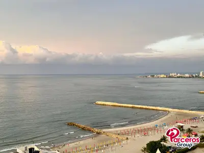 a view of a beach with a group of people at Amplio Apartamento Para Grupos Cerca Al Mar Por Parceros Group in Cartagena de Indias