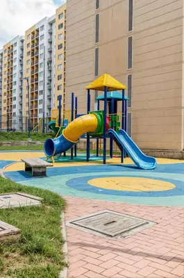 a playground with a slide in front of a building at Loft en Nrt de Barranquilla - Piscina - Mall 3 Min in Barranquilla