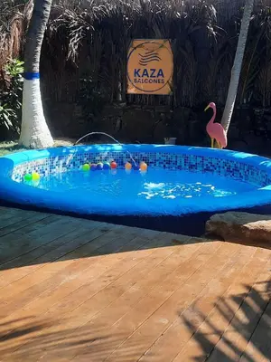 a swimming pool with a toy flamingo in it at KAZA Balcones in Santa Veronica