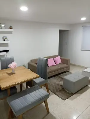 a living room with a couch and a table at Hermoso y cómodo apartamento in Cartagena de Indias