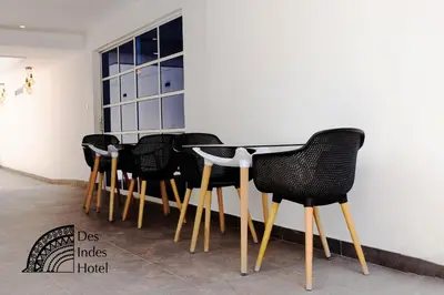 a row of black chairs sitting next to a table at DES INDES CARTAGENA in Cartagena de Indias