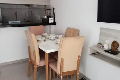 a dining room table and chairs in a kitchen at Apartamento Cerca Playa Marbella in Cartagena de Indias