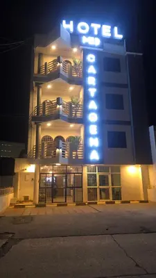 a hotel building with a lit up sign on it at Hotel Med Cartagena in Cartagena de Indias
