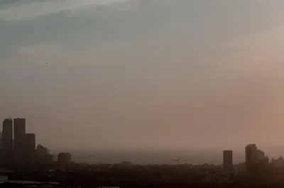 a city skyline on a foggy day with tall buildings at Apartamento El Colibri CARTAGENA en TORRE PRIMI in Cartagena de Indias