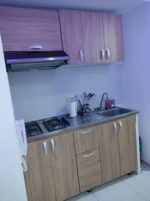 a small kitchen with a stove and a sink at Apto TORRE PRIMI - Cerca al mar in Cartagena de Indias