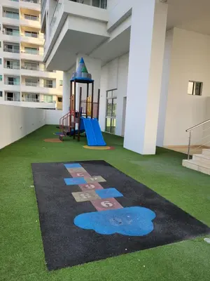 a playground on the floor of a building with grass at Apartamento cerca al Mar in Cartagena de Indias