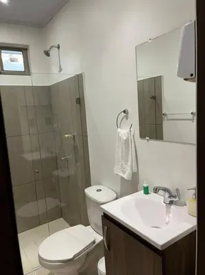 a bathroom with a shower and a toilet and a sink at Apartaestudio 1 en Barranquilla in Barranquilla