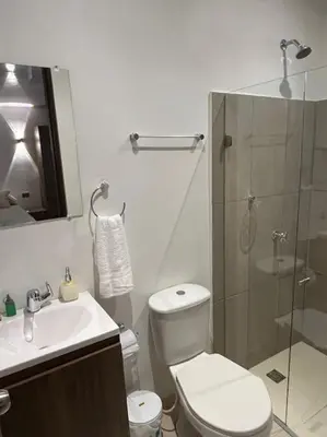 a bathroom with a toilet and a sink and a shower at Apartaestudio 2 en Barranquilla in Barranquilla