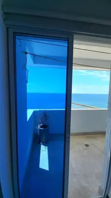 a blue glass door with a potted plant on it at Penthouse en Cartagena in Cartagena de Indias