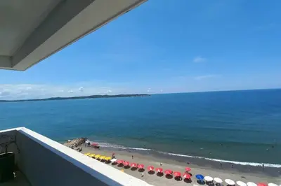a view of a beach with umbrellas and the ocean at Penthouse en Cartagena in Cartagena de Indias