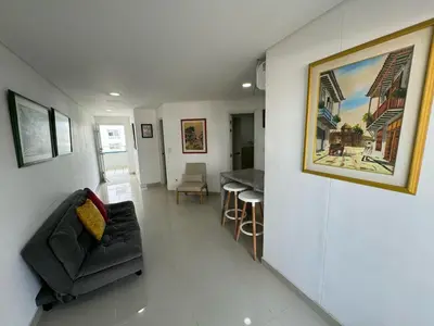 a living room with a couch and a painting on the wall at Apartamento en Edificio Portofino 606 ICDI in Cartagena de Indias