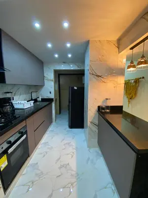 a kitchen with marble flooring and a refrigerator at YOLO solo se vive una vez - MORROS Cartagena in Cartagena de Indias