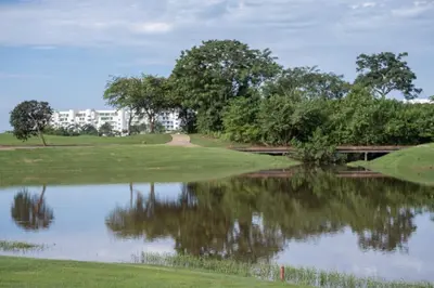 a view of a pond at a golf course at Villa Karibana Paradise in Cartagena de Indias