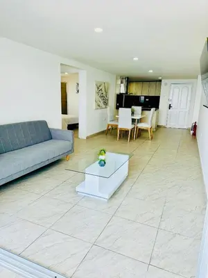 a living room with a couch and a table at Espectacular Ocean view, apartamento de dos cuartos, con vista al mar, en Cartagena de Indias in Cartagena de Indias