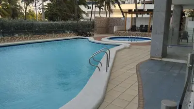 a swimming pool in a hotel with two smaller pools at Amazing Ocean View apartment with Pool in Laguito Cartagena in Cartagena de Indias